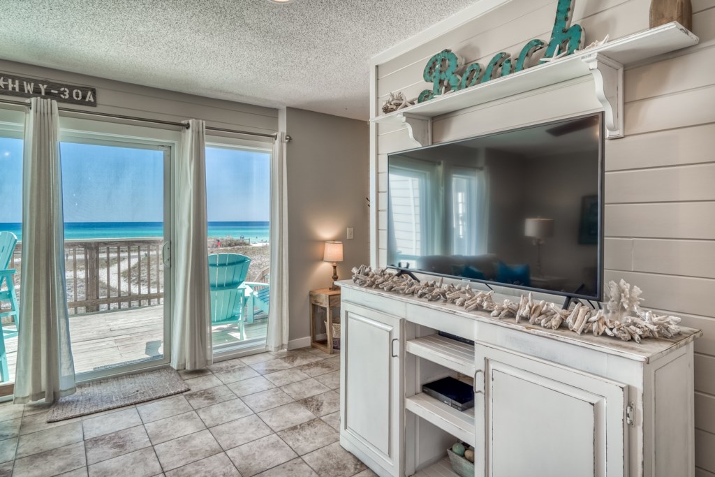 The living room offers a large flat screen television with cable, highspeed Wifi, and amazing Gulf views 