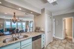 Modern kitchen with stainless appliances, stone countertops, and more beautiful views of The Emerald Coast