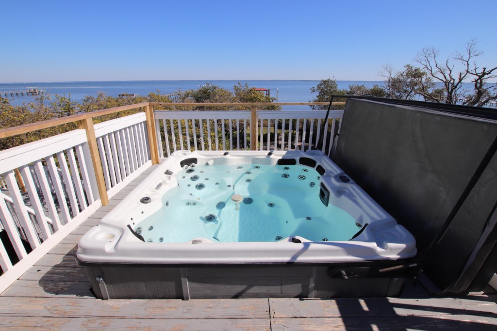 Serene views from an elevated private hot tub with seating for 6 overlooking St. Joseph Bay