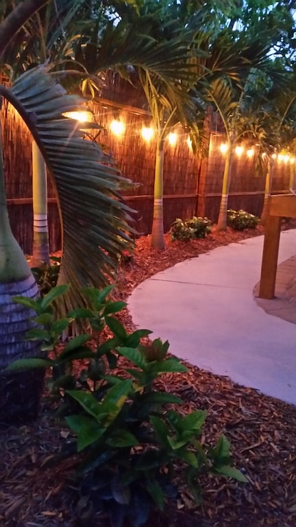 Allow warm night lighting to accent your way around the property.