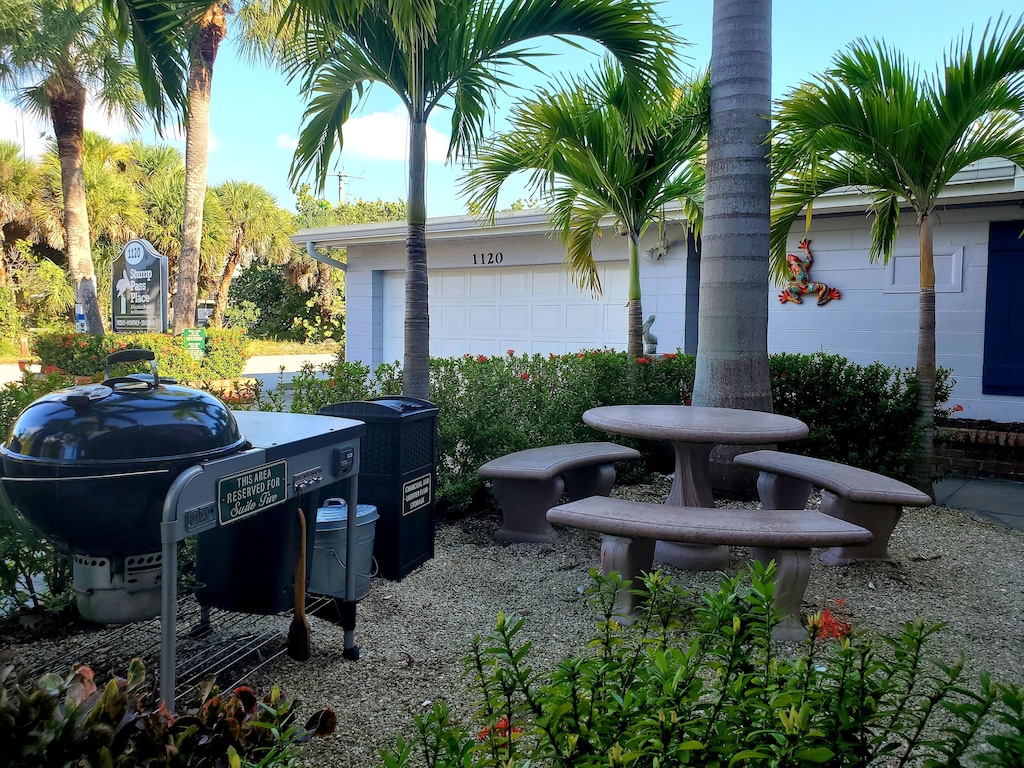 Your outdoor space with large Weber Grill. This area is softly lighted at night.