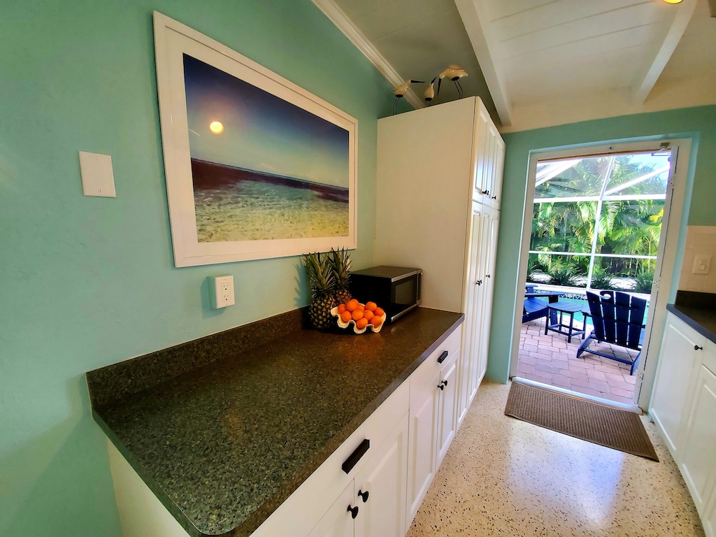 Walk out the back door into the enclosed pool Lanai.