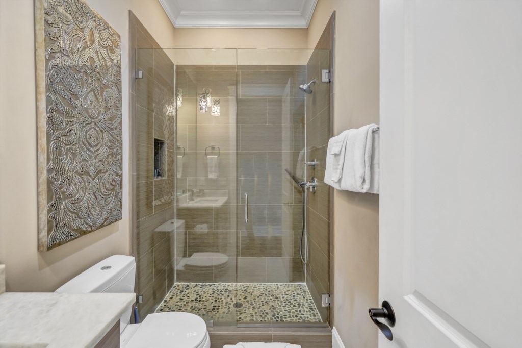 Beautiful attached bath with tiled walk-in shower 