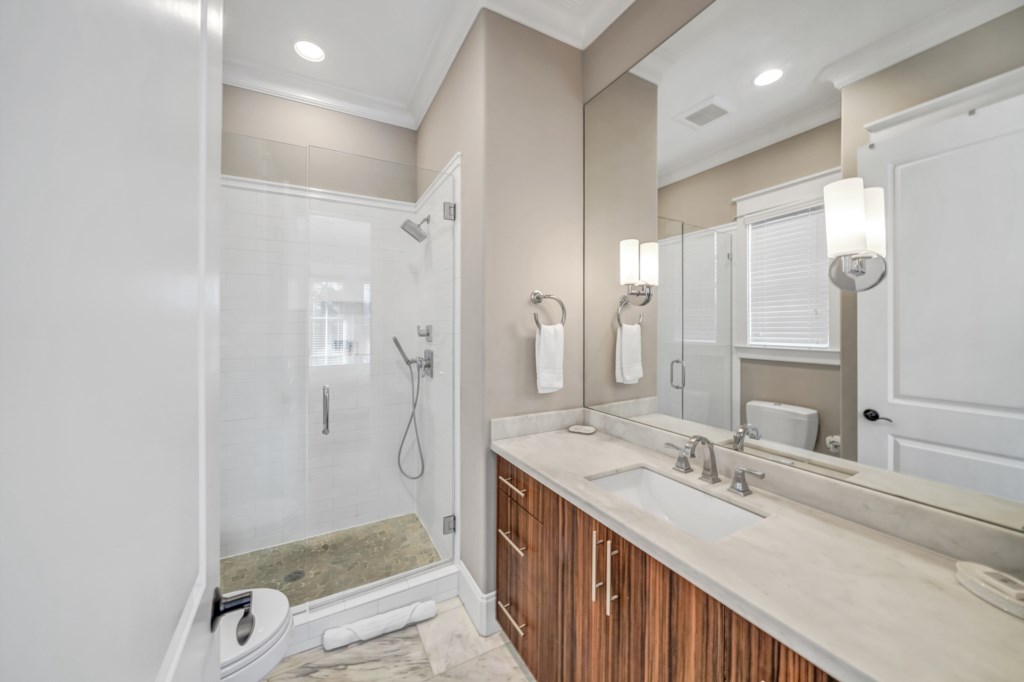 attached bath with walk-in shower and single vanity 