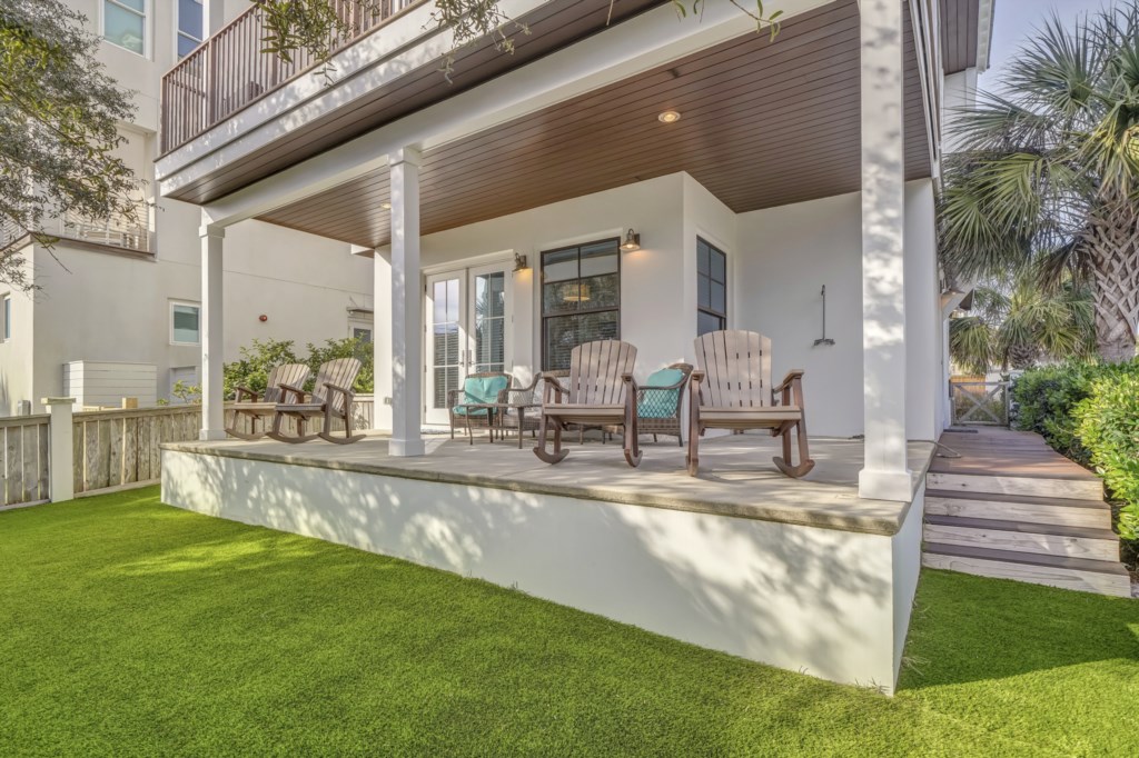 Fully fenced lawn with Sabal palms and Oak trees providing shade 
