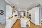 The kitchen boast Carrara marble and quartz countertops with genuine Oak floors 