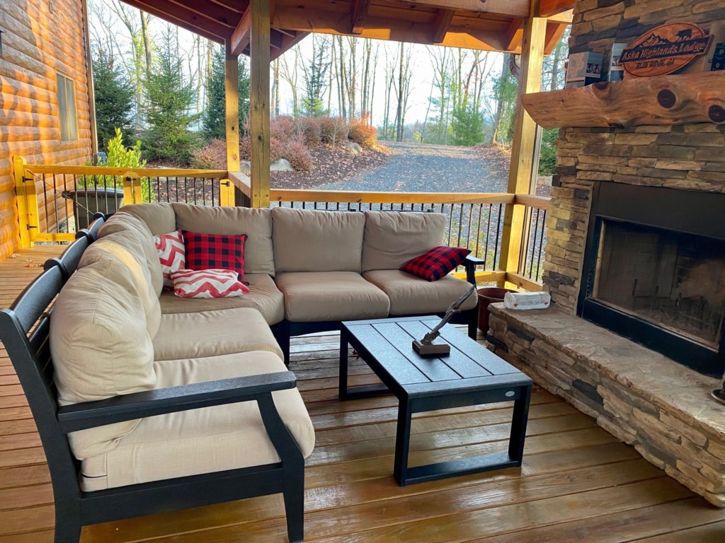 Wood burning fireplace and sitting area on the main level deck