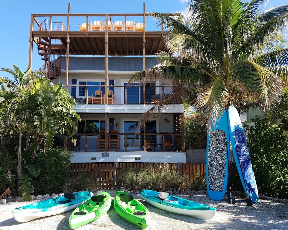 Welcome! Paddle with dolphins on our complimentary Kayaks & Stand up Boards! 