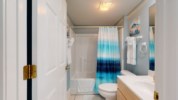 Shared bathroom on the primary floor with shower/tub combination 