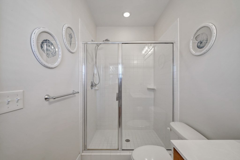 The primary bath features a walk-in shower