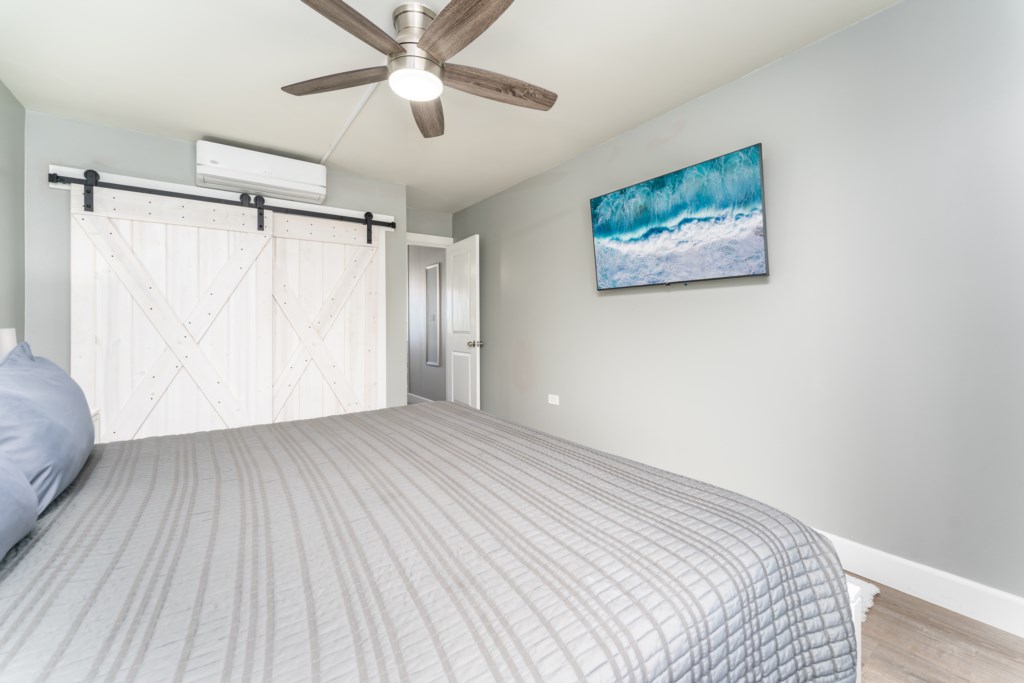 Cozy queen size bedroom with split AC to keep you cool
