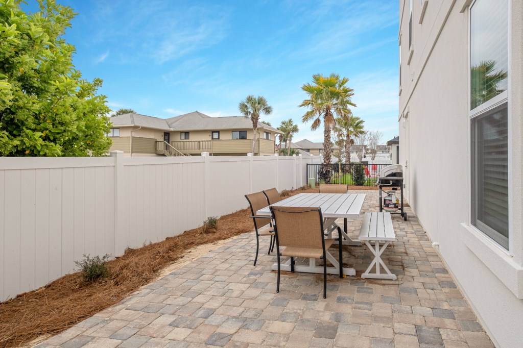 Spacious Rear Patio With A Propane Grill