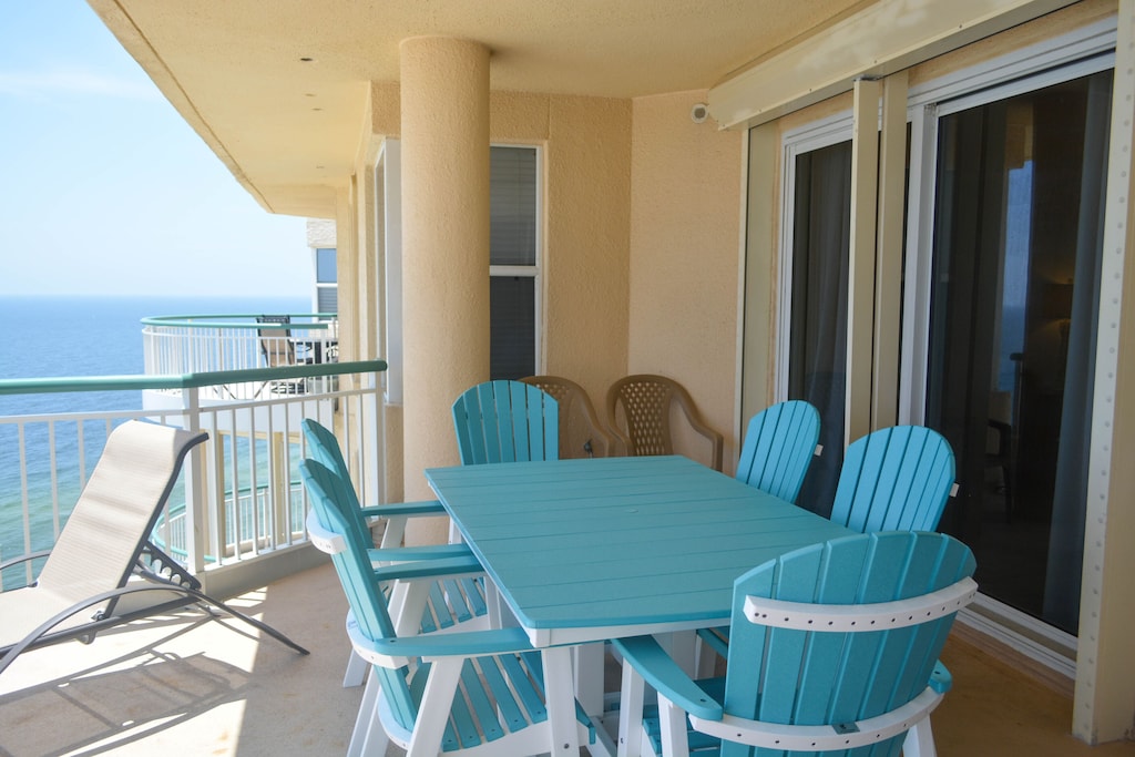 Furnished patio seating. Dining for six on balcony.