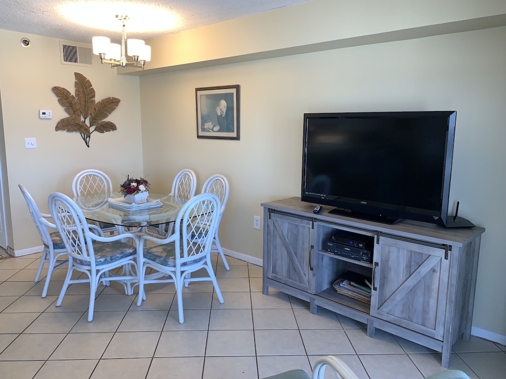 Big screen tv and dining area.