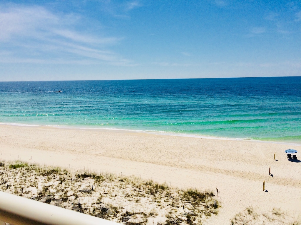 White sands and emerald waters of the Gulf.