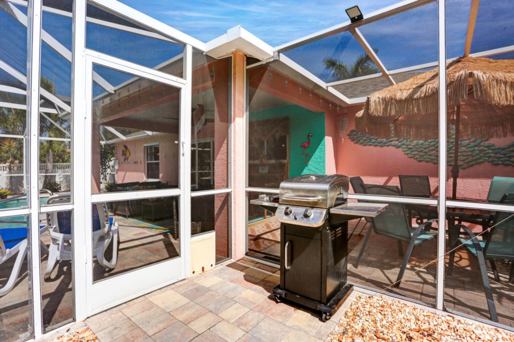 Screened dining area, perfect for outdoor meals.