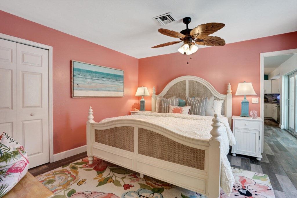 Charming beach-themed bedroom with cozy bedding and vibrant decor.