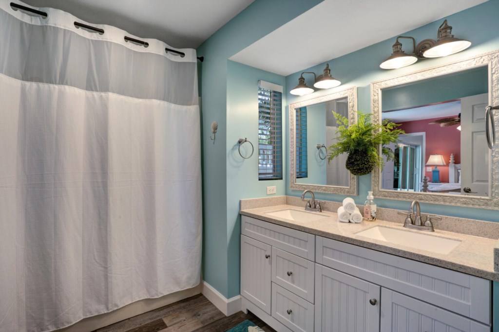 Master bathroom with double sinks and shower.
