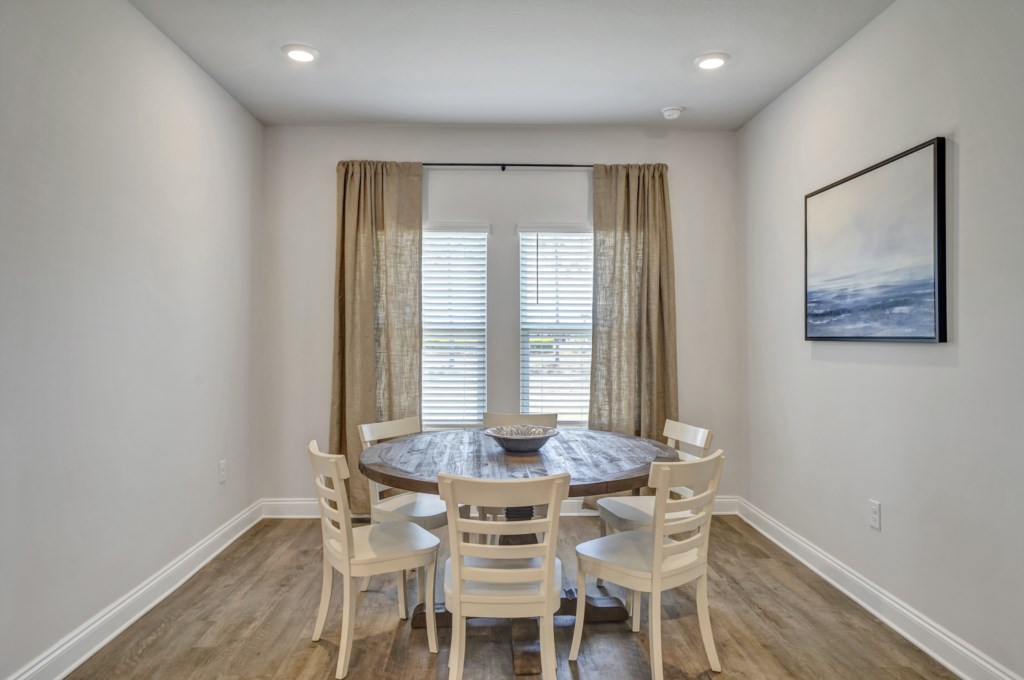 Ample seating is provided with a breakfast nook and formal dining room 
