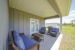 Large open patio with comfortable seating and propane grill