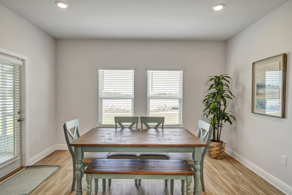 The dining area provides seating for 6 with an additional seating for 3 at the kitchen island 