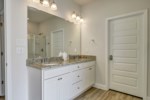 Attached primary bath with private water closet, soaking tub, and walk-in shower 