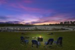 Enjoy smores with a wood burning firepit and a competitive game of cornhole while cotton candy skies dance overhead