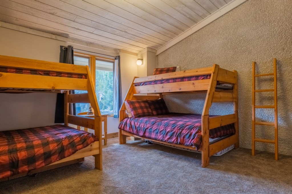 Bedroom 1: Twin over full bunks with hallway bathroom