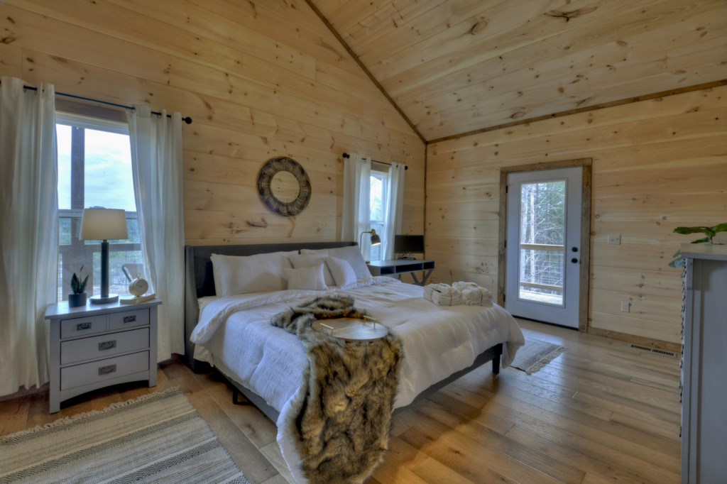 King master suite on the main level with designated work space with a mountain view 