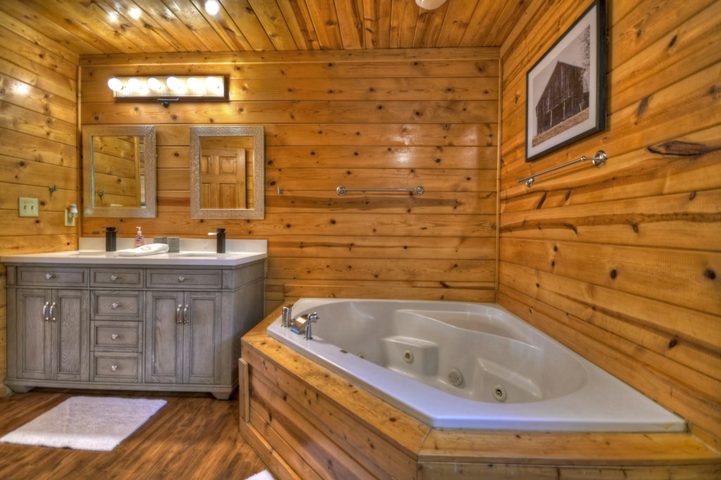 Master bathroom in the loft level with a stand alone jetted tub and walk in shower 