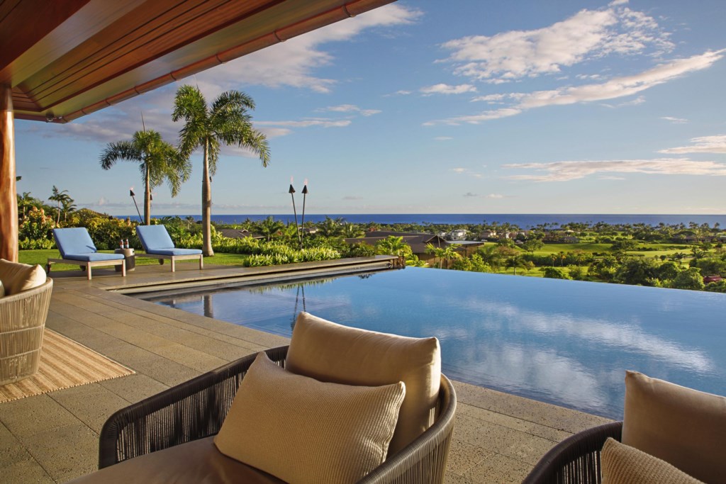 Ocean views with Tiki Torches and Plam Trees and infinity pool