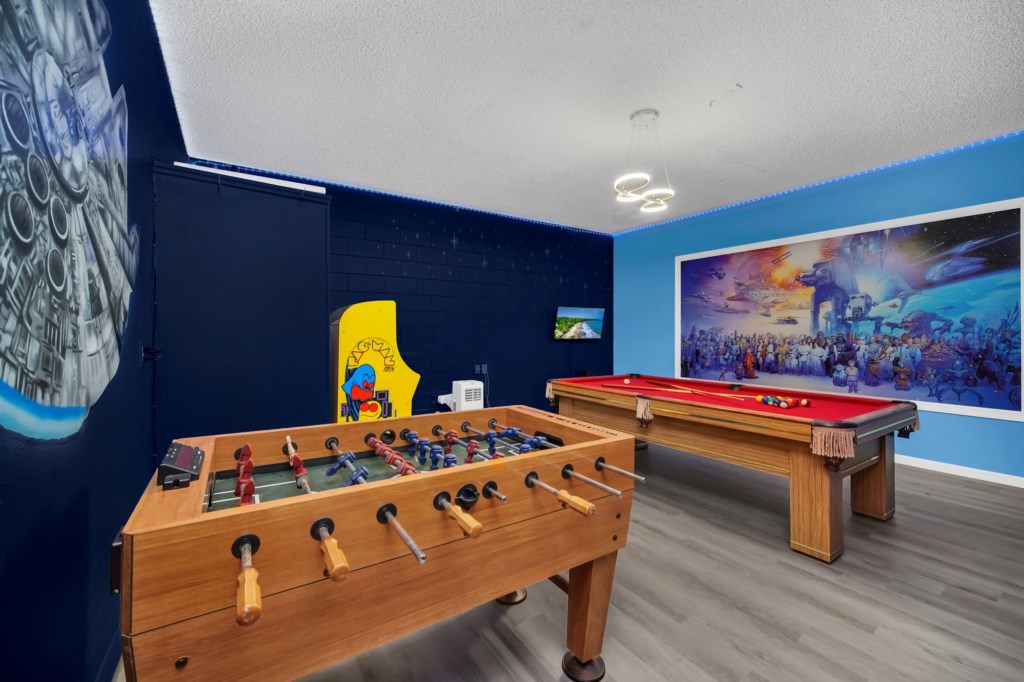 Game room with football, pool, Pac Man arcade and TV for gaming