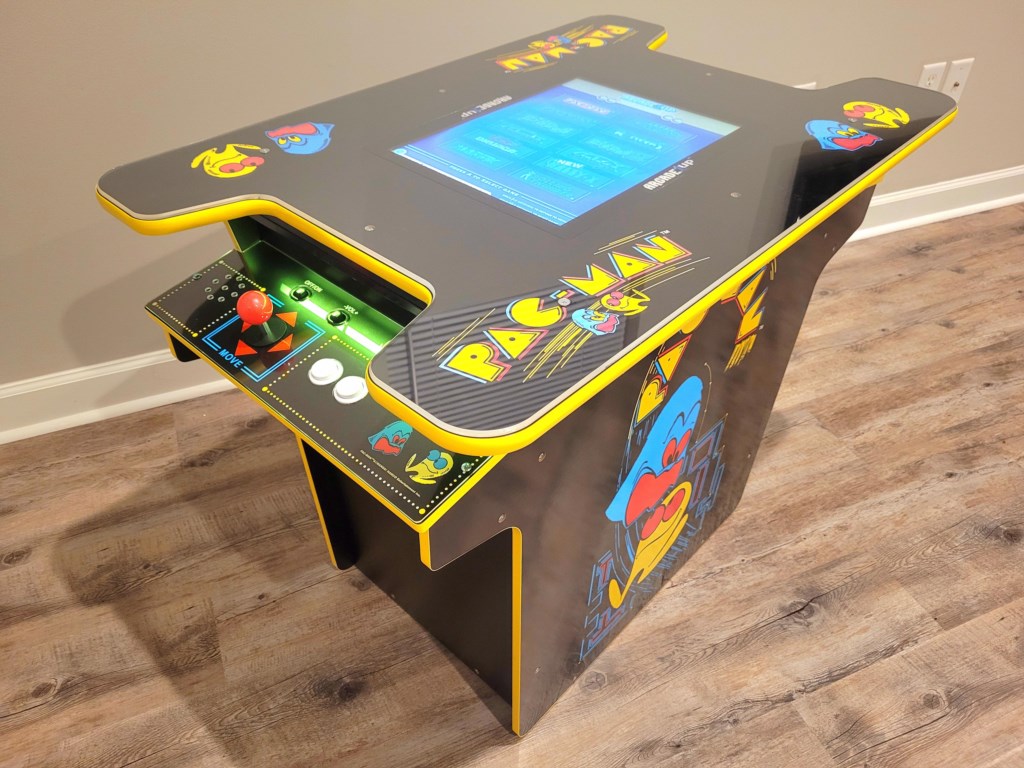 Arcade Game Console. No quarters required. Arcade game is changed out periodically to give repeat visitors variety.