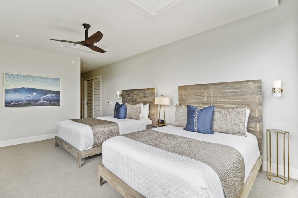 Ohana bedroom - features 2 queen size beds, desk, big screen TV and ocean view