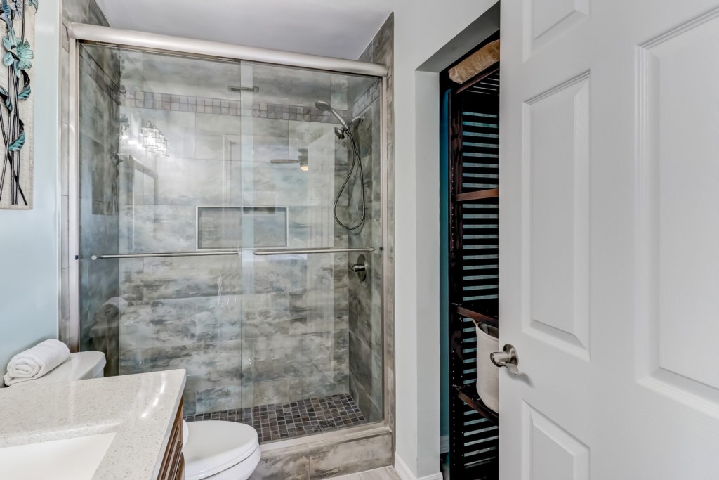 Main bathroom with walk-in tile shower
