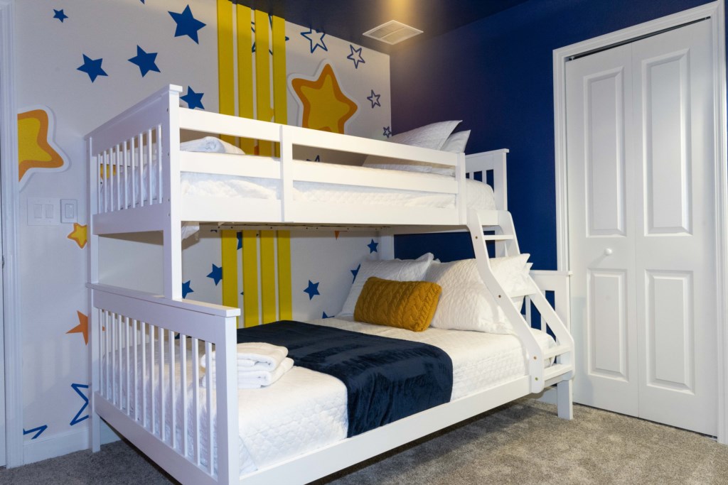 Disney themed bedroom with twin over full bunk bed & TV