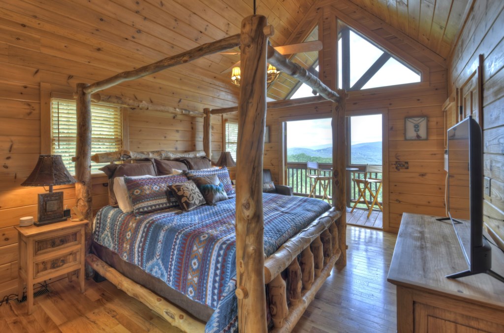 Loft level king master suite with double sided seasonal gas logs and private balcony