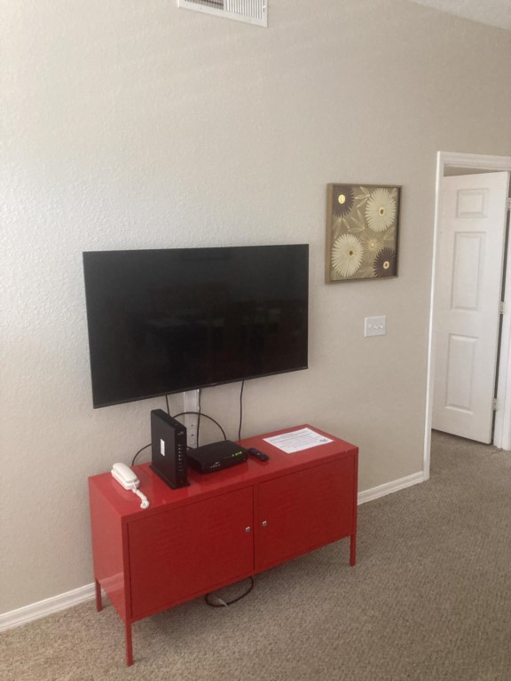 Large television on the wall in the living room