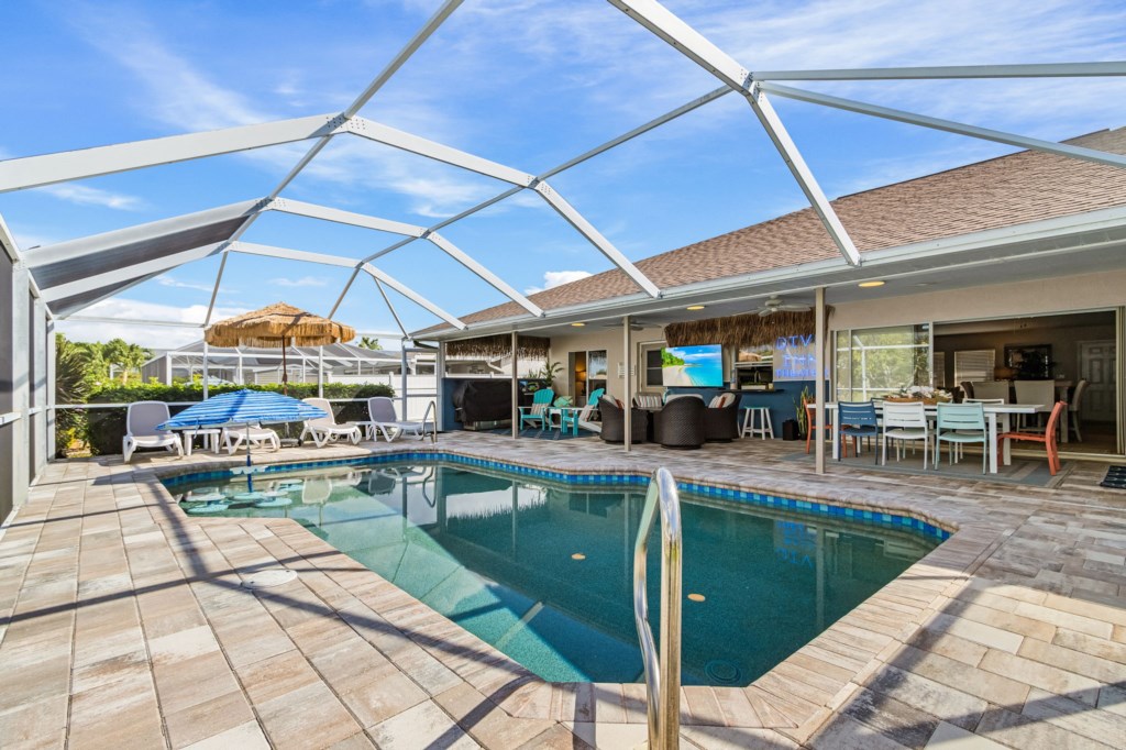 Brand new lanai area complete with resurfaced pool, tile, and pavered pool deck!
