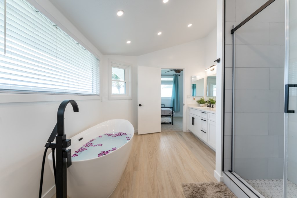 Renovated Primary Bathroom with Dual Vanities, Shower, and Large Soaking Tub 