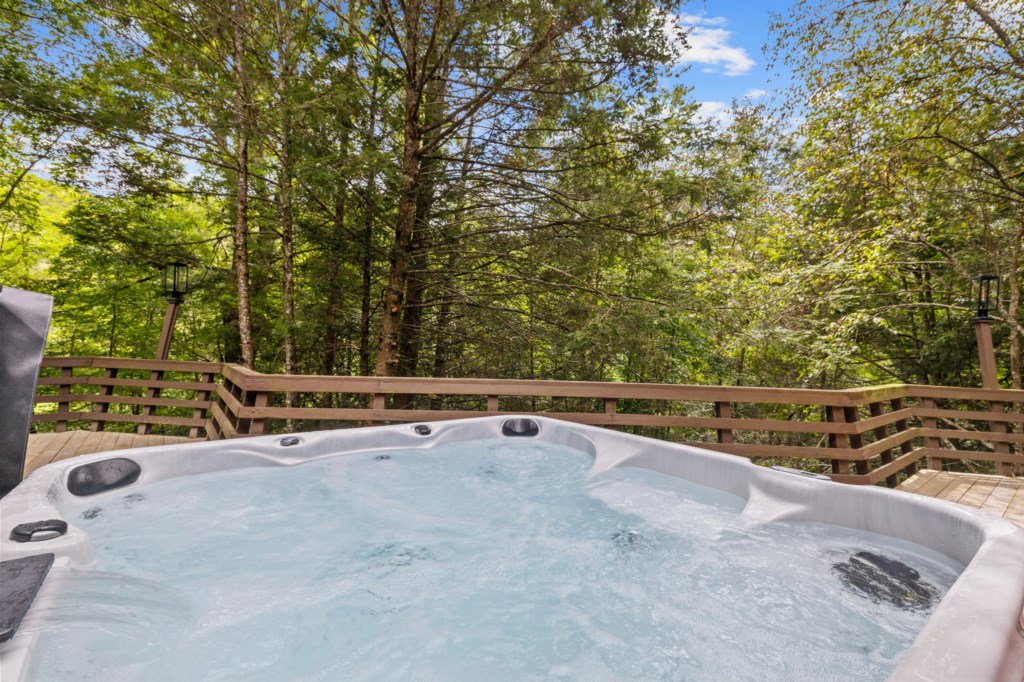 Large hot tub on deck.  Warm up on a cold evening and enjoy the views!