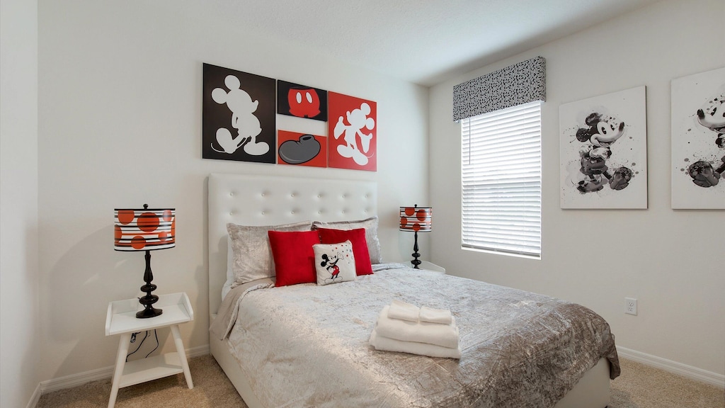 Kids can have some fun in this clean mickey themed room