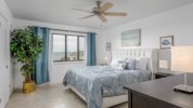 Fall asleep to the sounds of the bay in the master bedroom king sized bed