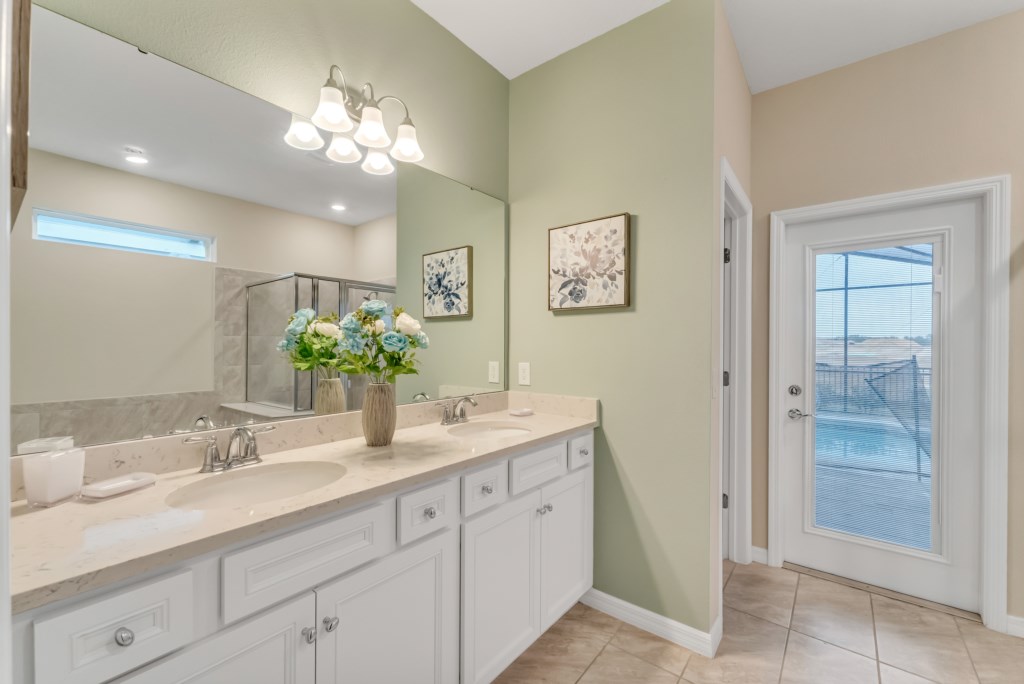 Bedroom #2 ensuite bathroom with access to the lanai patio