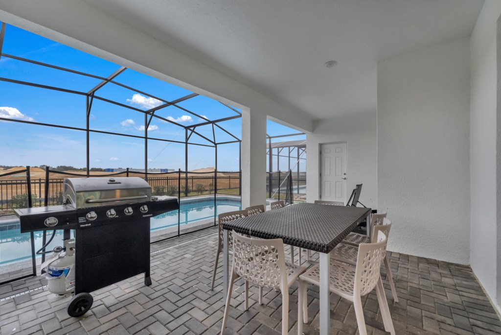 Grill up some dinner and enjoy it on this lanai patio!