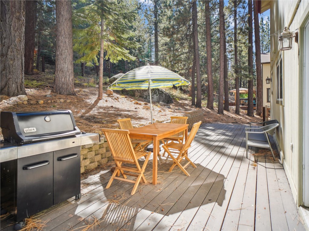 Back deck with grill and dining area at High Sierra :)