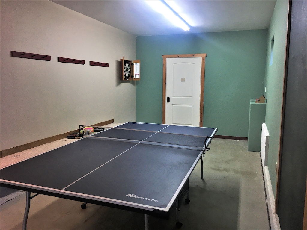 Ping Pong Table and Dart Board in Garage