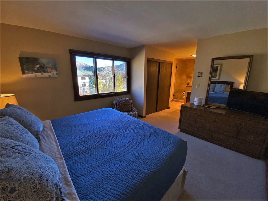 Master Bedroom with Queen Bed, TV in Room, and Private Bath