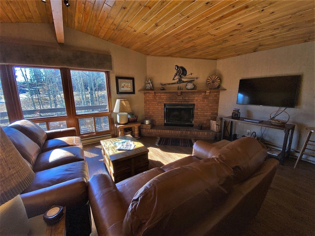 Living Room has Wood Fireplace