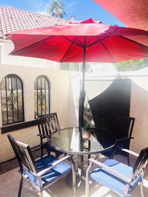 Entry area patio with BBQ and shade